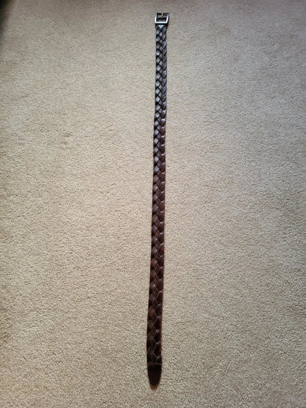 Braided brown leather belt with silver tone buckle
